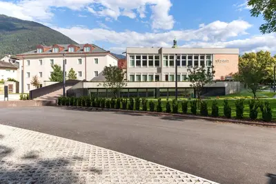 an empty street in front of a building at Cusanus Akademie - Accademia Cusanus in Bressanone