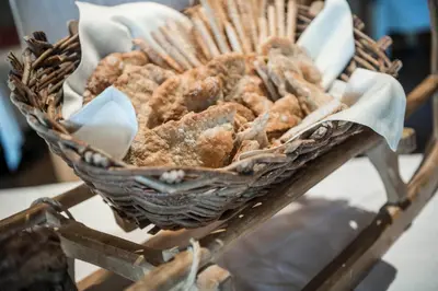 a basket of food sitting on top of a table at Hotel Onach in San Lorenzo di Sebato