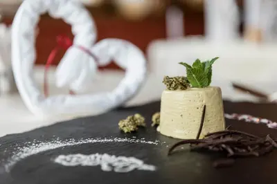 a piece of cake sitting on top of a table at Hotel Onach in San Lorenzo di Sebato