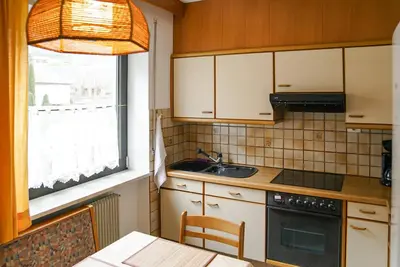 a kitchen with a sink and a stove top oven at Appartements Residence Ganthaler in Rablà