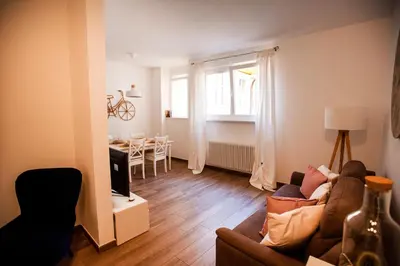 a living room with a couch and a table at Portico ventizerodue in Merano