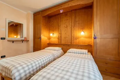 a snow covered mountain with footprints in the snow at Casa Gabriella in Fiera di Primiero