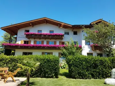 a large white building with flowers on it at Residence Klementhof 4 in Fiumes
