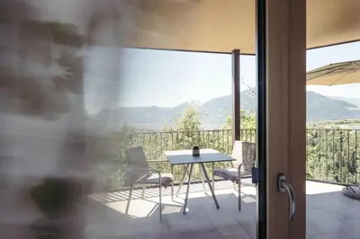 a table and chairs on a balcony with a view at Villa Bea in Caines