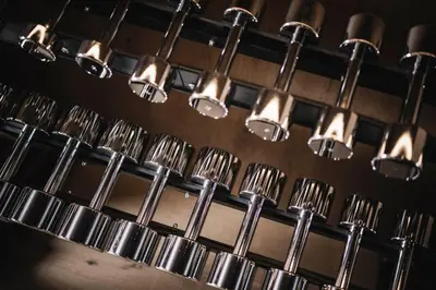 a bunch of silver utensils hanging from a wall at Luxury Chalet Alpurio in Selva di Val Gardena