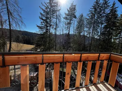 a deck with a view of the mountains at Casa Vacanze Natura in Mendola