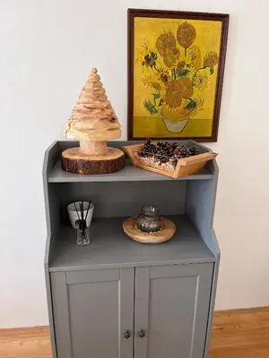 a grey cabinet with a painting on the wall at Casa Vacanze Natura in Mendola
