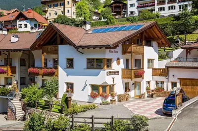 a house with solar panels on the roof at Cesa Sara in Ortisei