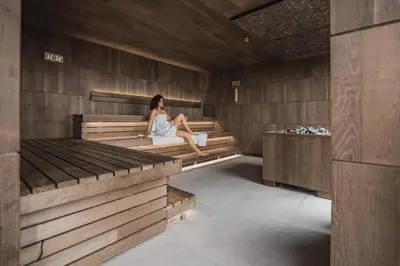 a bedroom with a bed and a desk and a deskablish at Hotel Emmy - five elements in Fiè