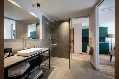 a bathroom with a sink and a shower at Mühlwaldhof Appartement in Fiumes