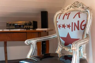 a rocking chair with a manking sign on it at Il Florino Maia in Merano