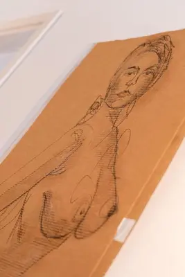 a drawing of two people on a piece of wood at Il Florino Maia in Merano