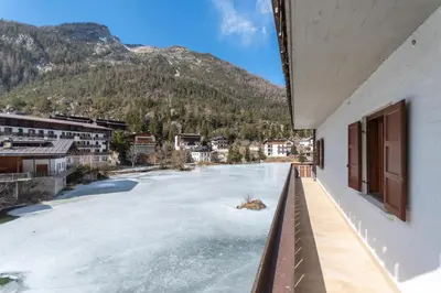 a view of a river from a balcony of a building at Miralago in Alleghe