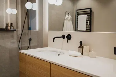 a bathroom with a sink and a shower at meralino boutique apartment in Merano