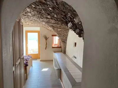 a bedroom with two bunk beds and a bed at CASA DIAF appartamento incantevole Carano Ville di Fiemme in Carano