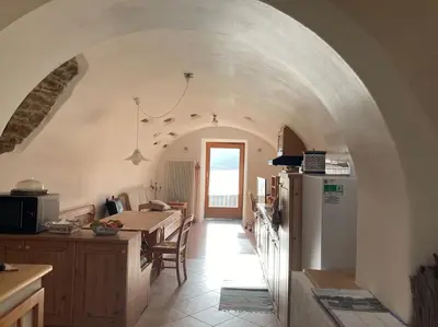 a bathroom with a sink and a shower with a mirror at CASA DIAF appartamento incantevole Carano Ville di Fiemme in Carano