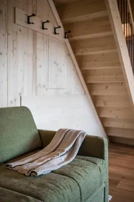 a blanket sitting on a couch in a room at Stadl Chalet oberhalb Brixen in Rosa