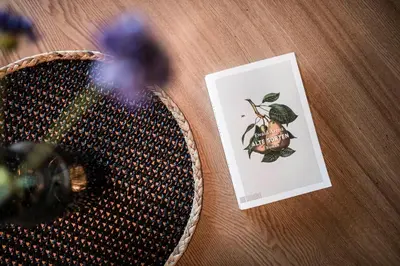 a tennis racket sitting on a table next to a card at Stadl Chalet oberhalb Brixen in Rosa