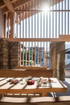 a wooden table with food on it in a building at Stadl Chalet oberhalb Brixen in Rosa