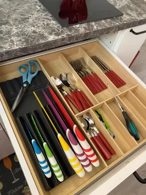 a wooden tray filled with different colored utensils at Franz home Wi-Fi AC 1 free parking in Bolzano