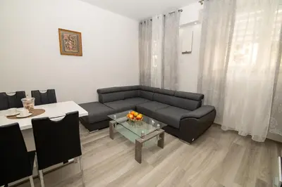 a living room with a couch and a table at Junior Deluxe 2 in Merano