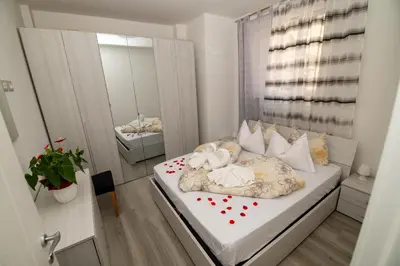 a small bedroom with a bed with hearts on it at Junior Deluxe 3 in Merano
