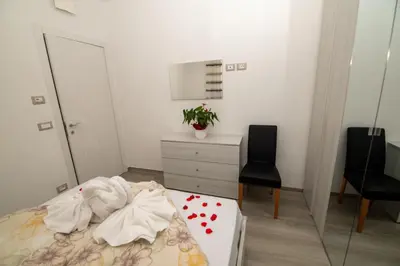 a bedroom with a bed with a mirror and a dresser at Junior Deluxe 3 in Merano