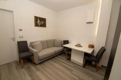 a living room with a couch and a table at Junior Deluxe 3 in Merano