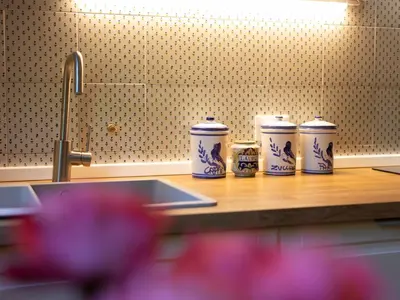 four blue and white cups sitting on a counter at Villa Atelier Baron Killi in Caldaro