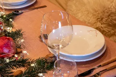 a table with two wine glasses sitting on a table at iFlat Chalet Carole Ortisei in Ortisei