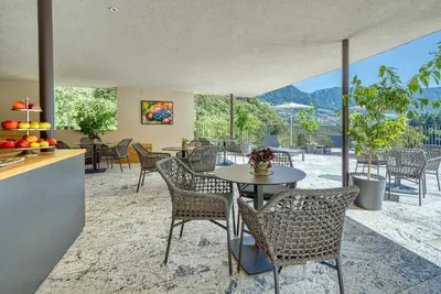 a dining room with a table and chairs at Castanea Appartements in Caines