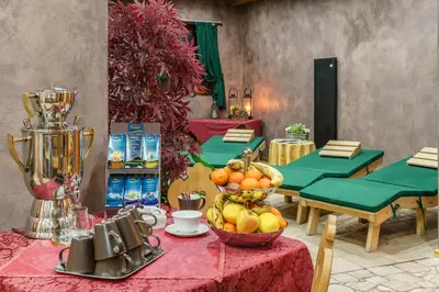 a table with a bowl of fruit on it at Hotel Olimpia in Cortina dʼAmpezzo