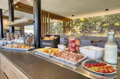 a buffet with different types of food on a counter at Auhof in Merano