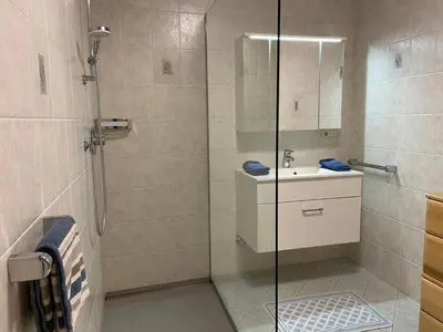 a bathroom with a shower and a sink at Ferienwohnungen Kaltenbachhof - Urlaub auf dem Biobauernhof in Parcines