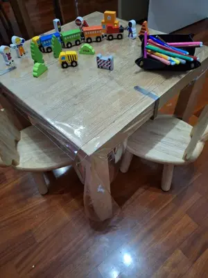 a wooden table with a toy train on it at Appartamento Merano nel cuore in Merano