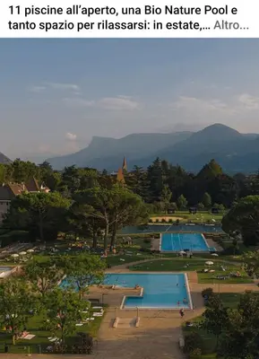 a view of a park with two swimming pools at Appartamento Merano nel cuore in Merano
