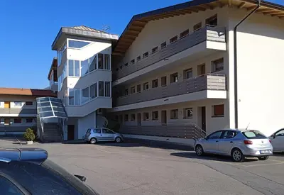 two cars parked in a parking lot in front of a building at Apartment Himmelreich 29 in Plaus
