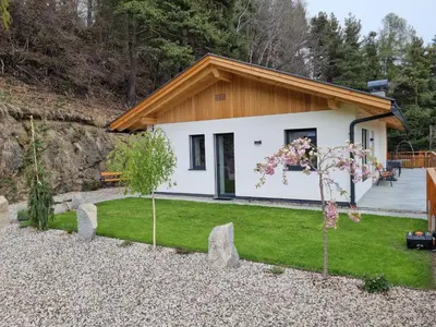 a cottage with a garden in front of it at Alone in Chalet with view on Dolomites in Villandro