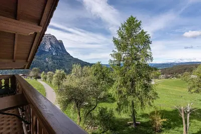 a balcony with a view of a mountain at Treffhof in Siusi