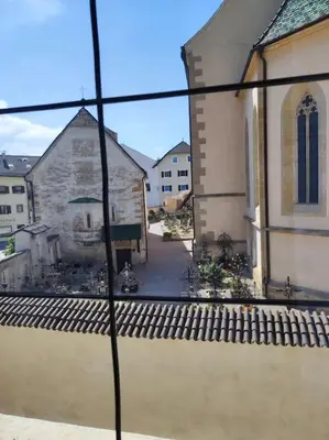 a view from a window of a church at Gemütliches Studio mit Garagenparkplatz in Vols am Schlern