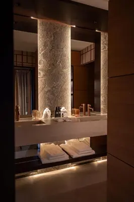 a bathroom with a sink and a toilet and a shower at Eight Cortina in Cortina dʼAmpezzo