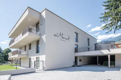 a white building with the words all rock on it at Residence aMoret in Bressanone