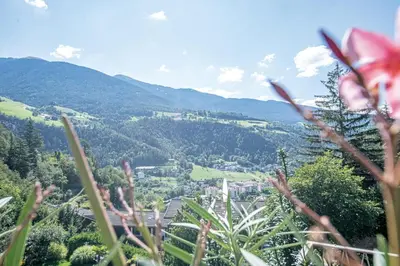 a view of a city from the top of a mountain at Residence aMoret in Bressanone