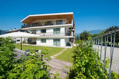 a house on the side of a mountain at Apartment Edelweiss in Brunico
