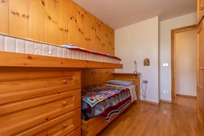 a bedroom with a bunk bed in a room at Casa Maura in Soraga