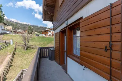 a balcony with a view of a house at Casa Maura in Soraga