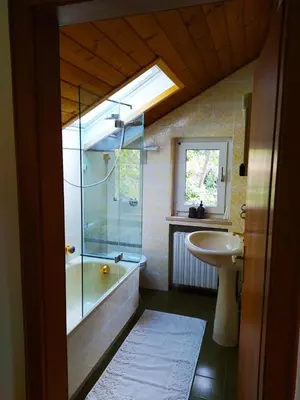 a bathroom with a glass shower and a sink at TORRE GARDEN HOME - casa singola nella città di Bolzano con giardino privato in Bolzano