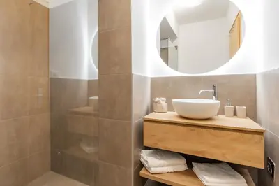 a bathroom with a sink and a mirror at Ansitz von Wohlgemuth in Salorno sulla Strada del Vino