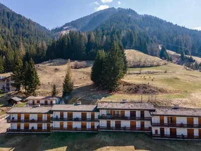 an aerial view of a building in the mountains at Residence Marmolada in Pozza di Fassa