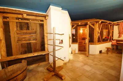 a large room with wooden walls and a wooden floor at Hotel Akelei in Brunico